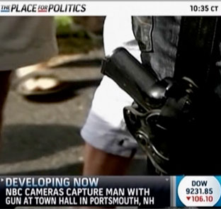 Gun-at-town-hall-chyron